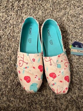 TOMS Slip-On Sneakers in Teal and Pink medical accents